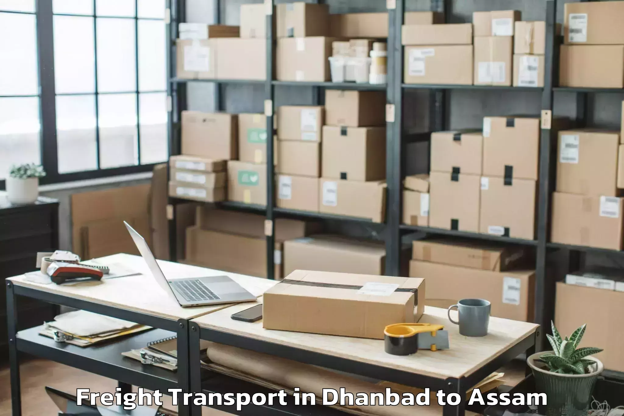 Top Dhanbad to Lumding Rly Colony Freight Transport Available